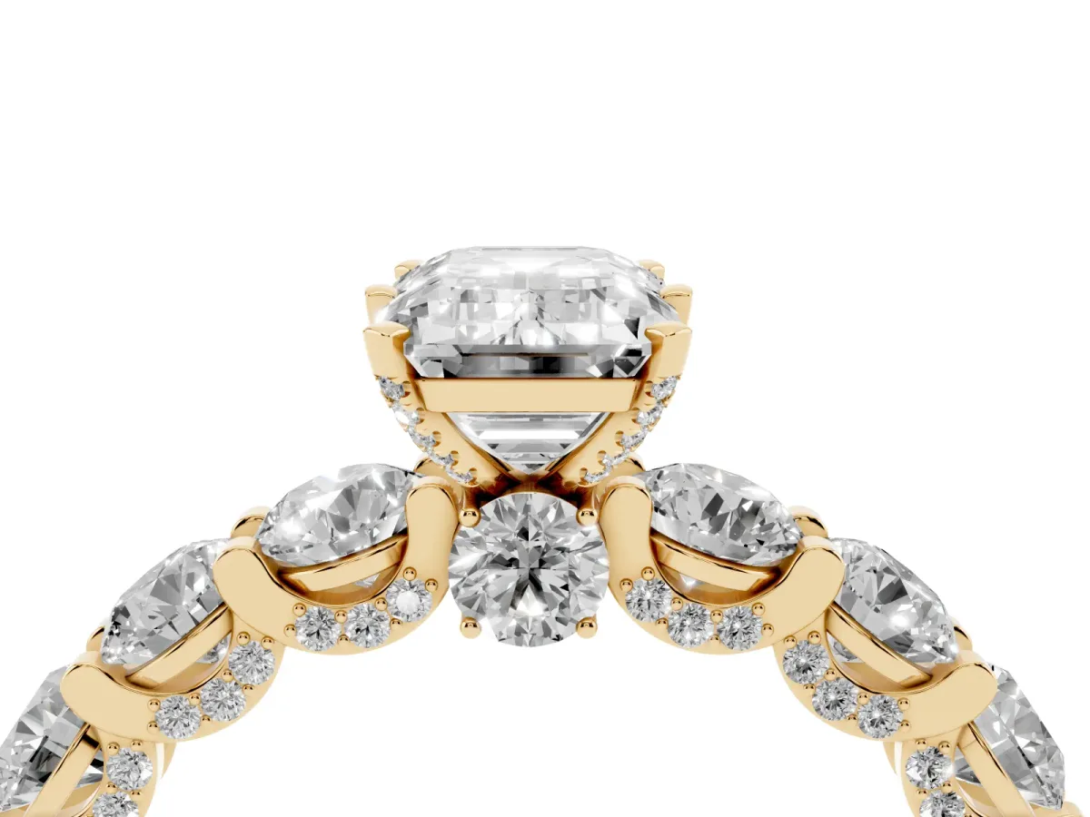 Emerald Cut Diamond Side Stone Engagement Ring with Four-Prong Setting Yellow gold