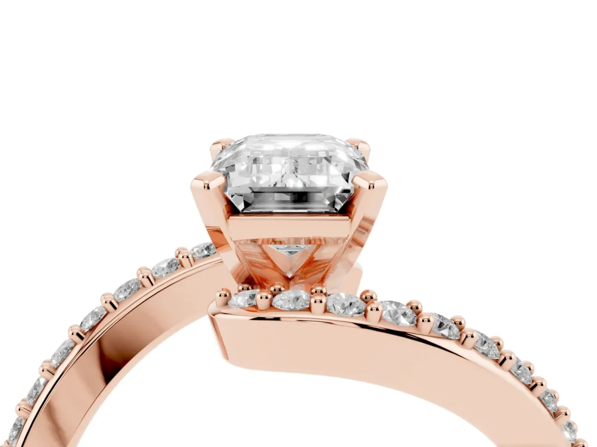 Emerald Cut Solitaire Twist Band with Pave Set Diamonds and Four-Prong Setting Rose gold