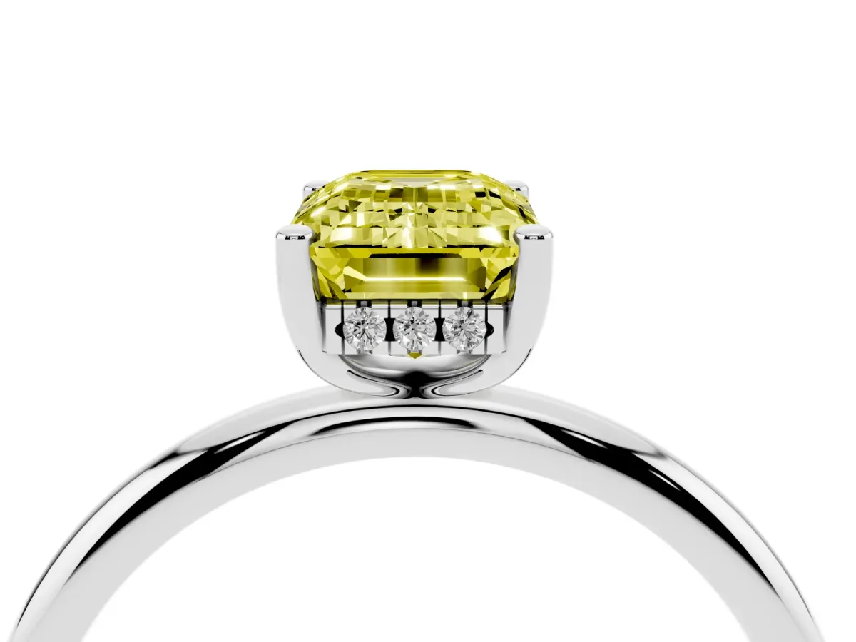 Fancy Yellow Emerald Cut Cut Solitaire Engagement Ring with Four-Prong Setting and Classic Band Silver