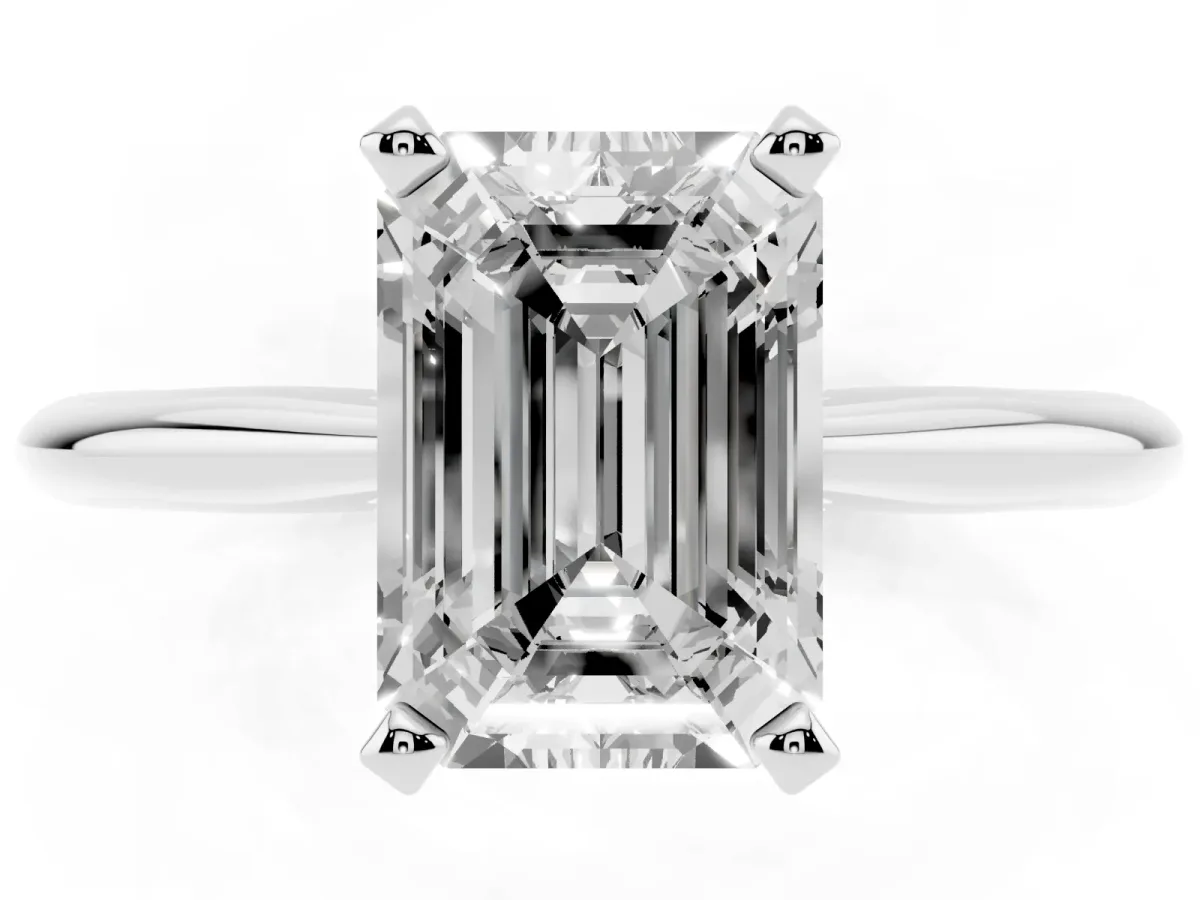Emerald Cut Cut Solitaire Ring with Four-Prong Setting on a Classic Band Silver