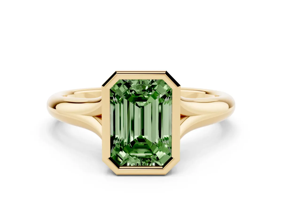 Fancy Green Bezel Set Emerald Cut Solitaire Diamond Ring with Smooth Band Yellow gold