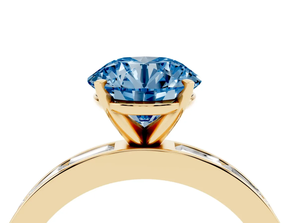 Fancy Blue Round Cut Solitaire Diamond Ring with Channel-Set Baguette Band and Four-Prong Setting Yellow gold