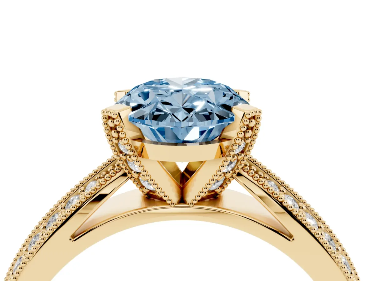 Fancy Blue Oval Cut Diamond Solitaire Ring with Milgrain Round Pavé Band and Prong Setting Yellow gold