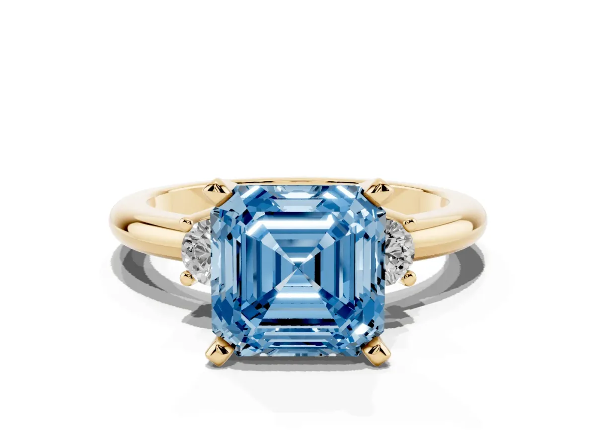 Fancy Blue Three-Stone Asscher Cut Cut Diamond Solitaire with Prong Setting and Classic Band Yellow gold