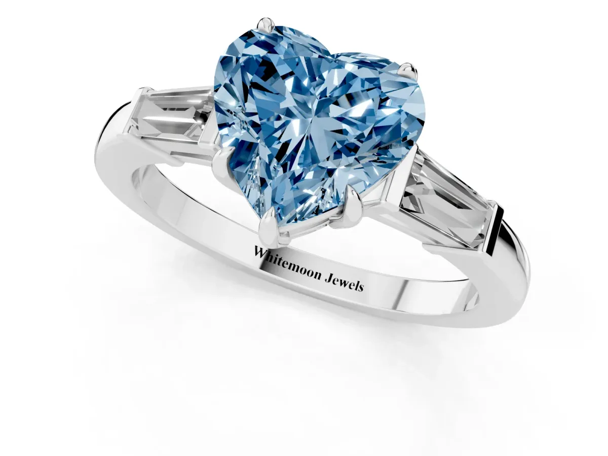 Fancy Blue Heart Cut Diamond Three-Stone Ring with Tapered Baguette Side Stones and Prong Setting Silver