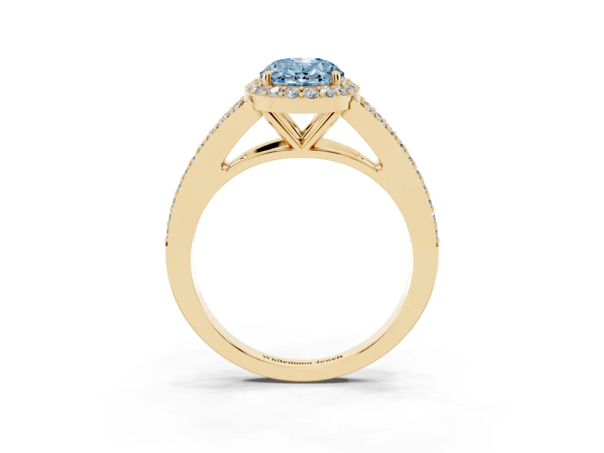 Fancy Blue Oval Cut Halo Split Shank Pave Diamond Ring with Four-Prong Setting Yellow gold