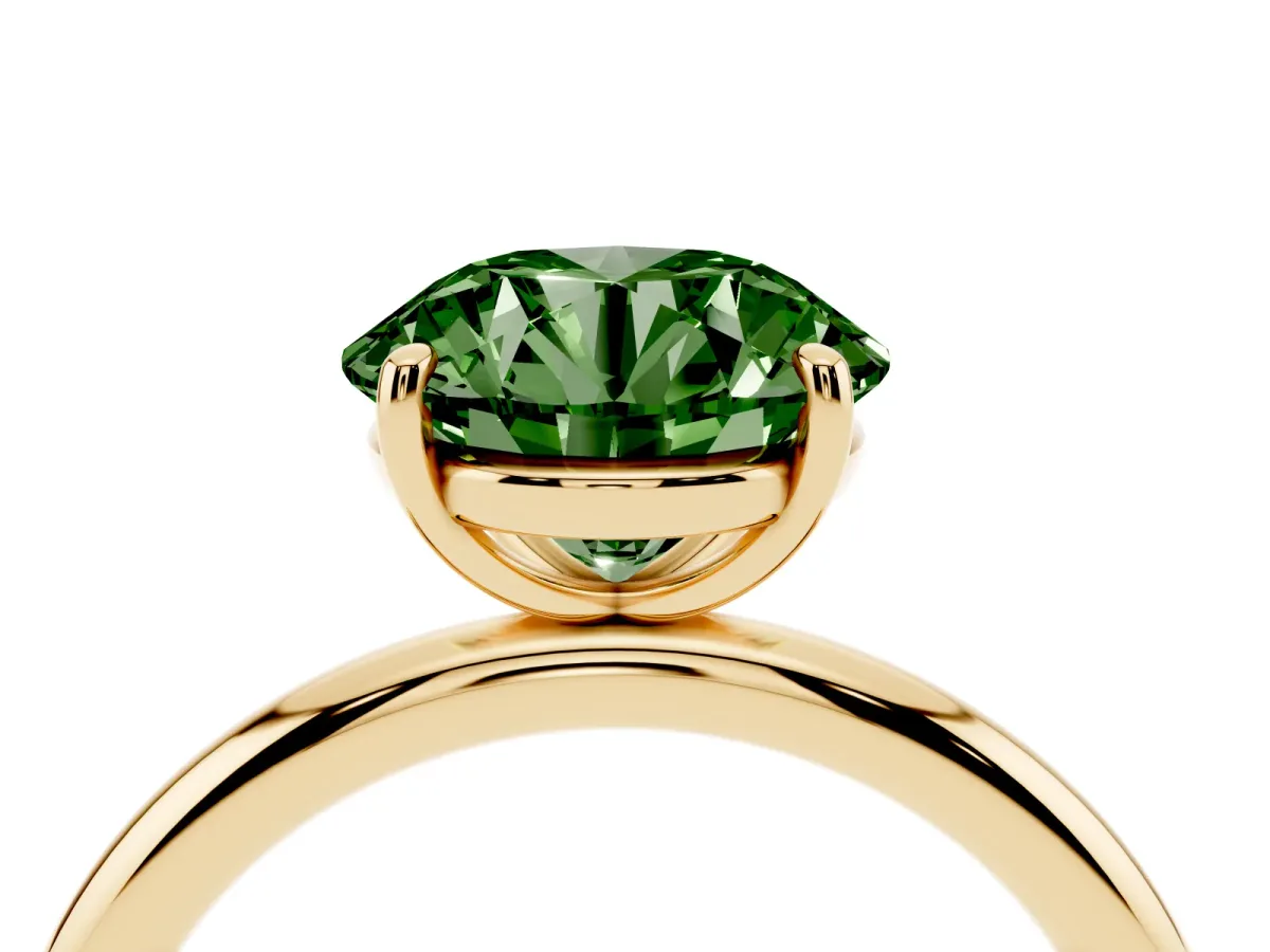 Fancy Green Round Cut Solitaire Diamond Ring with Four-Prong Setting on a Plain Band Yellow gold