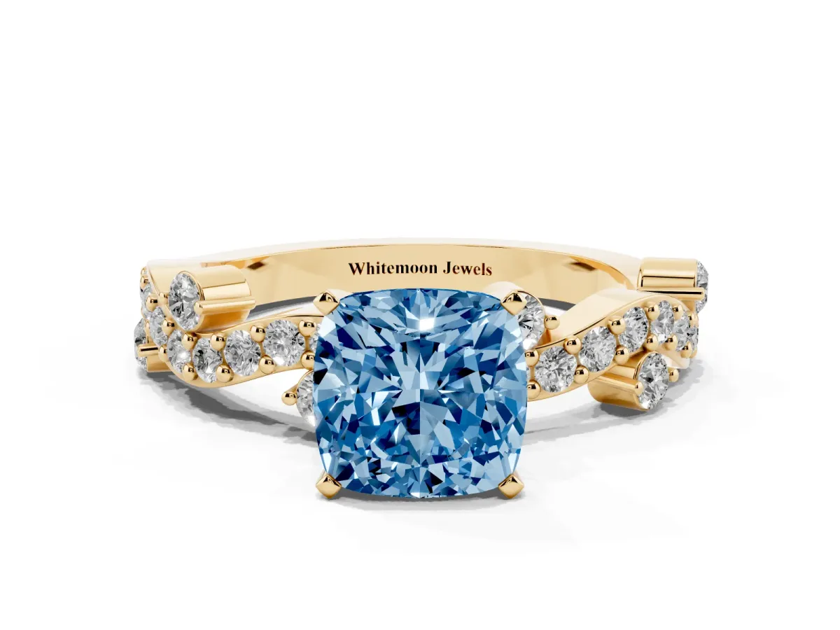 Fancy Blue Cushion Cut Cut Solitaire Diamond Twisted Band with Pave Setting Yellow gold