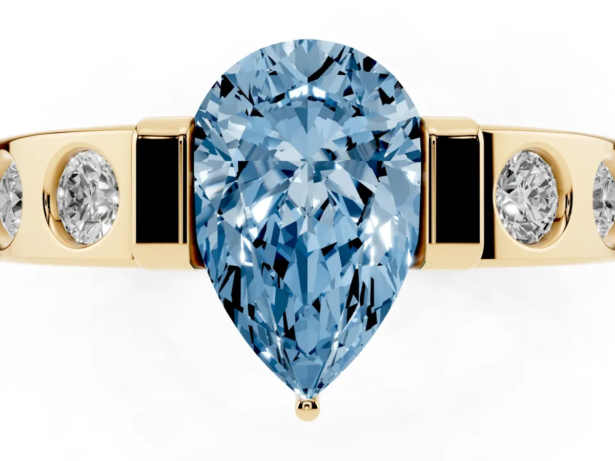 Fancy Blue Pear Cut Brilliant Channel-Set Diamond Ring with Bezel Prong Setting Yellow gold