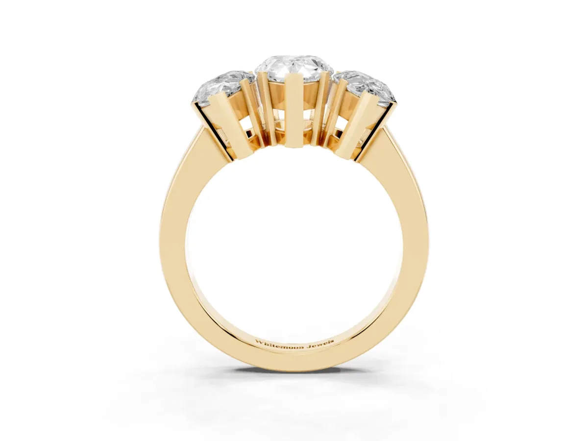 Three-Stone Pear Cut Cut Diamond Ring with Channel Set Band and Four-Prong Setting Yellow gold
