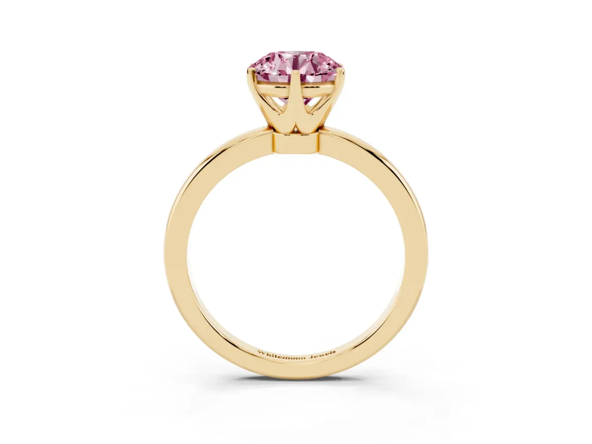 Fancy Pink Round Cut Solitaire Diamond Ring with Six-Prong Setting on a Classic Band Yellow gold