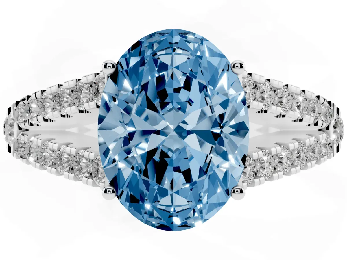 Fancy Blue Oval Cut Diamond Split Shank Pavé Engagement Ring with Four-Prong Setting Silver