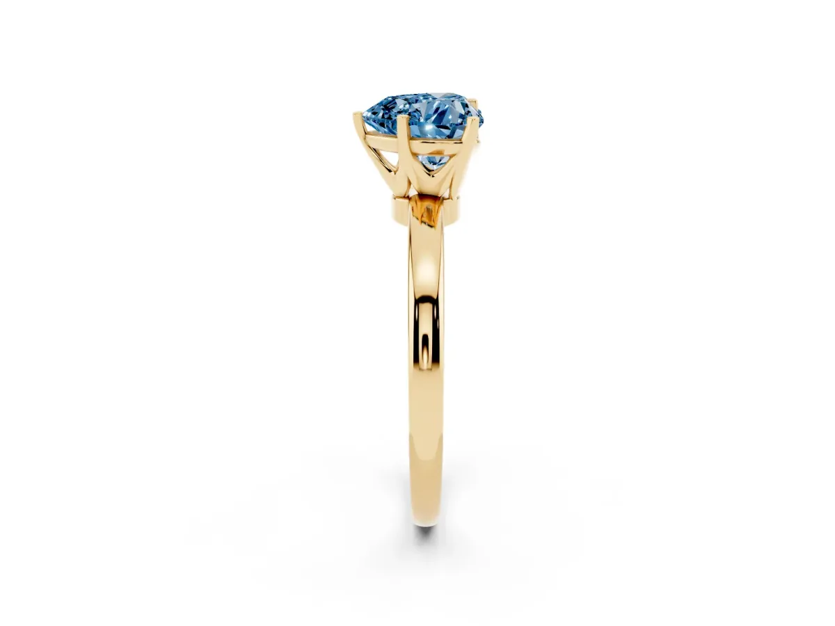 Fancy Blue Heart Cut Solitaire Diamond Ring with Six-Prong Setting on a Classic Band Yellow gold