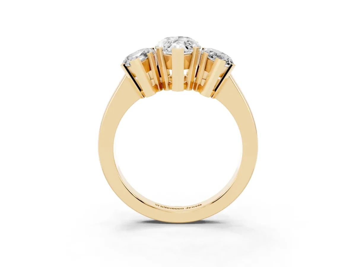 Three-Stone Marquise Cut Cut Diamond Ring with Channel Set Band and Four-Prong Setting Yellow gold