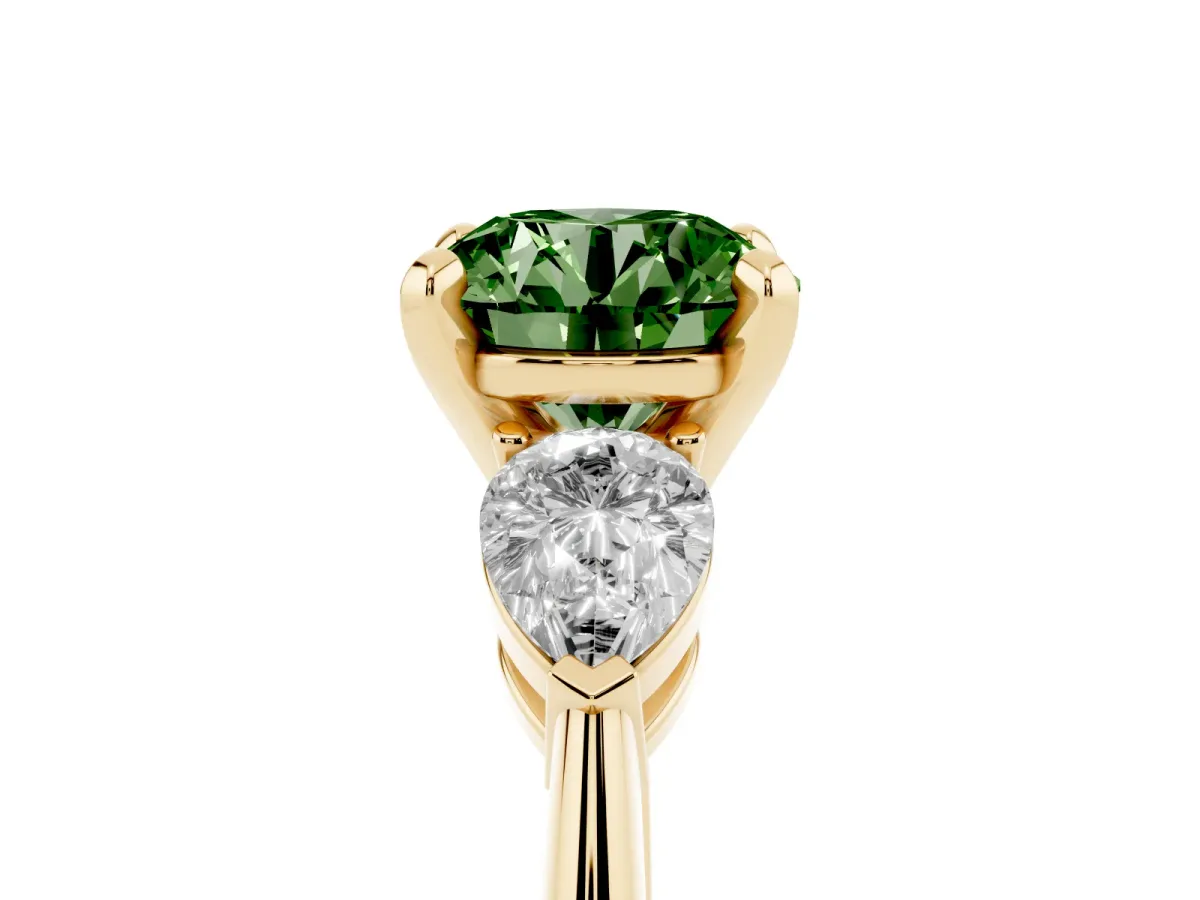 Fancy Green Three-Stone Round Cut Diamond Ring with Pear Side Stones and Four-Prong Setting Yellow gold