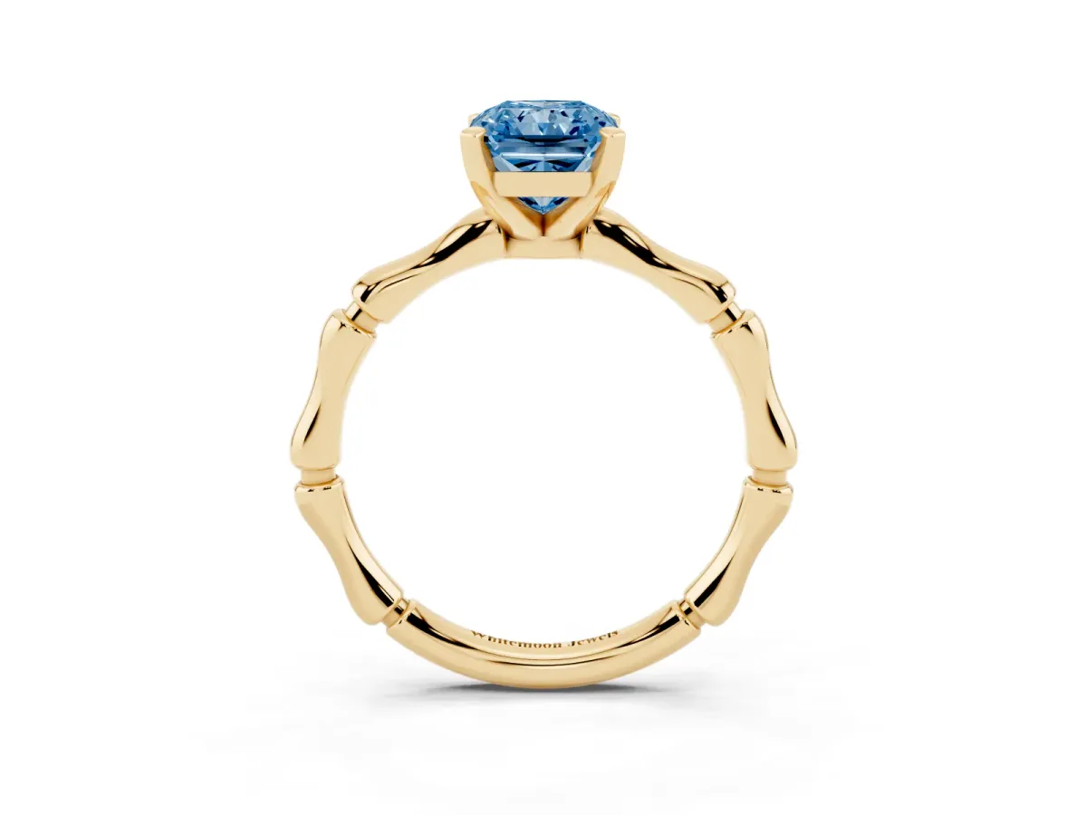 Fancy Blue Radiant Cut Solitaire Diamond Ring with Bamboo Band and Four-Prong Setting Yellow gold