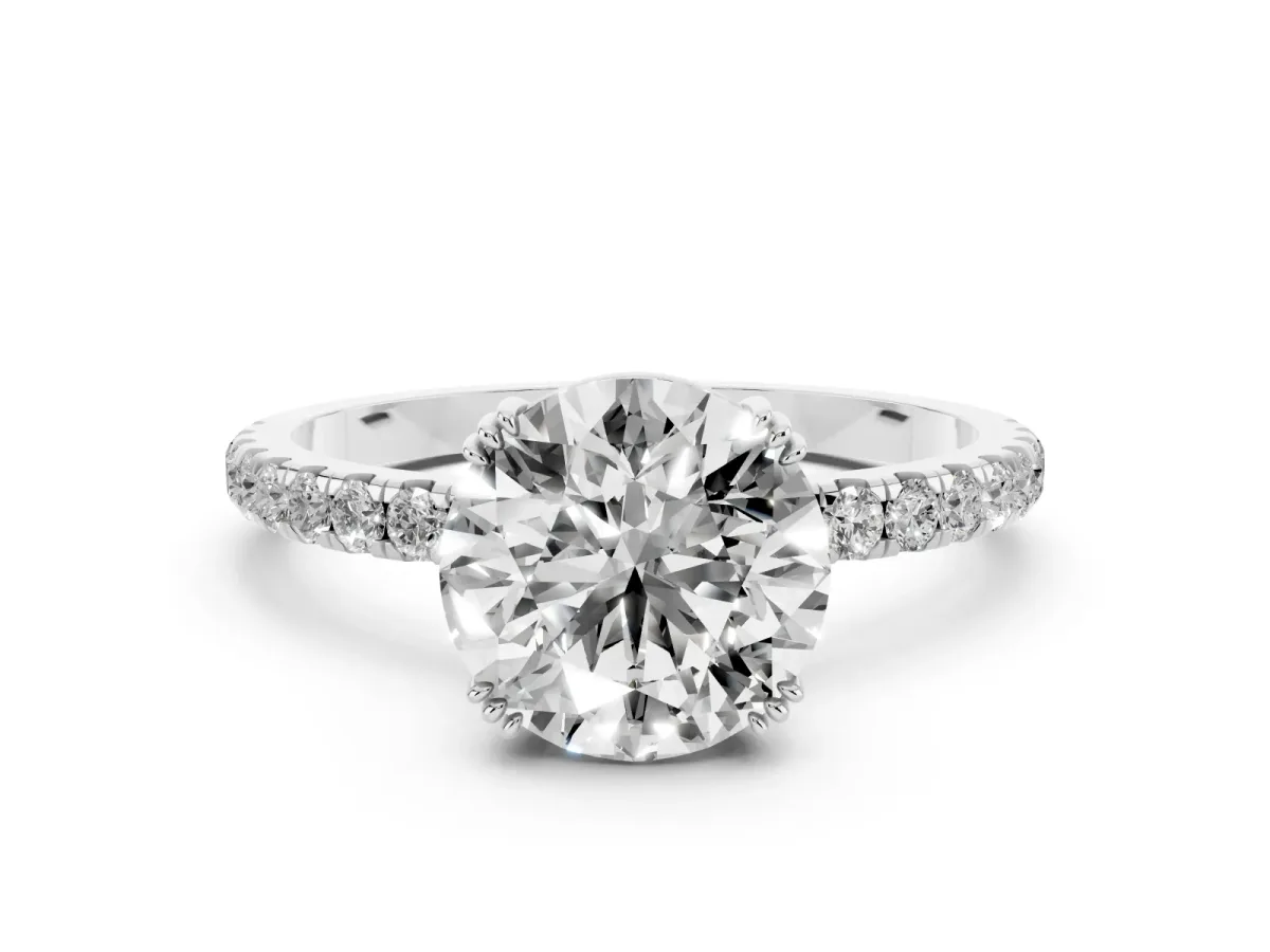 Round Cut Brilliant Solitaire with Pavé Band and Claw Prong Setting Platinum