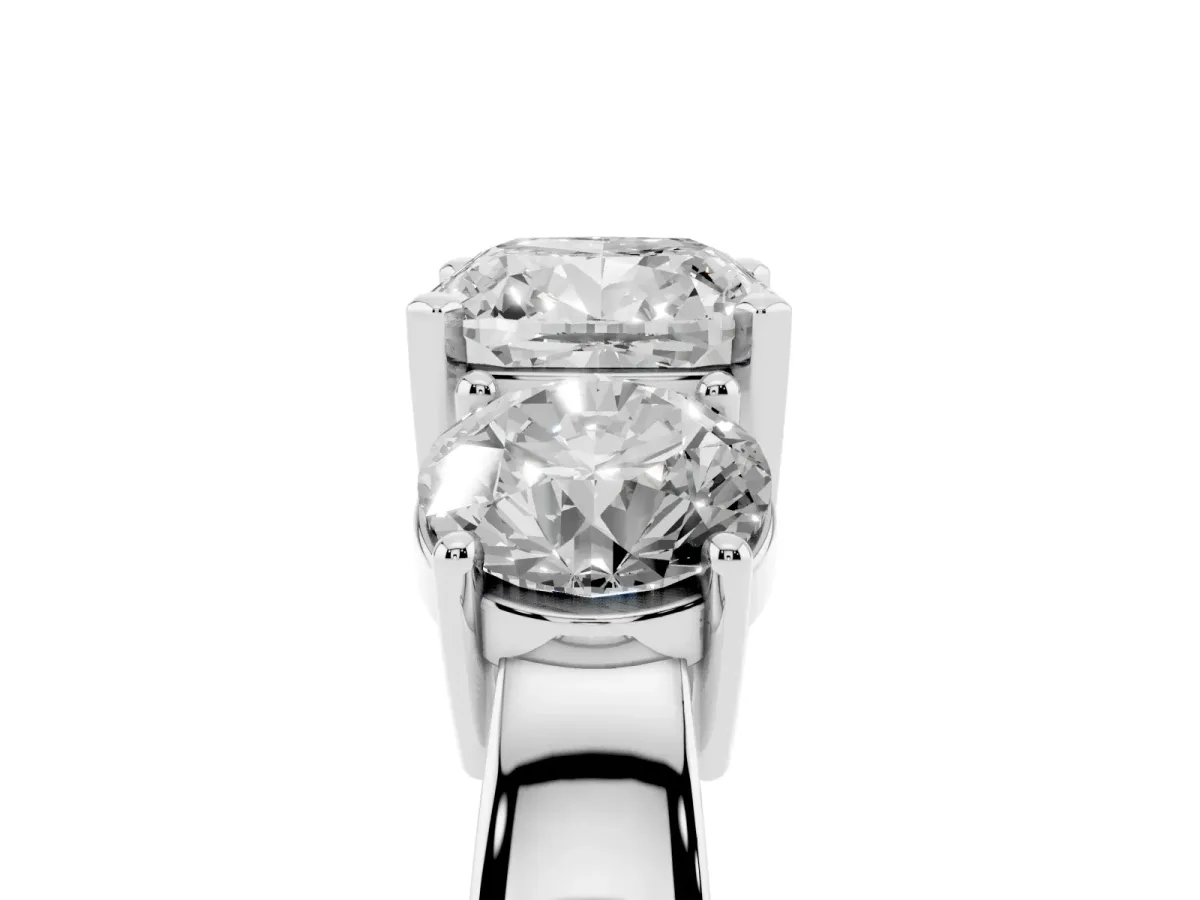 Three-Stone Cushion Cut Diamond Ring with Round Side Stones, Classic Band, and Four-Prong Setting Silver