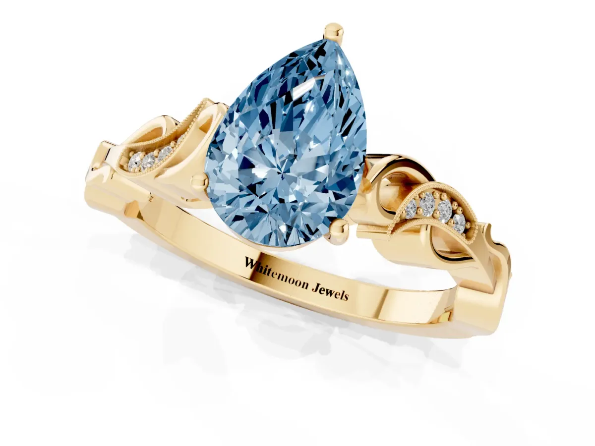 Fancy Blue Pear Cut Solitaire Vine Band with Milgrain Prong Setting Yellow gold