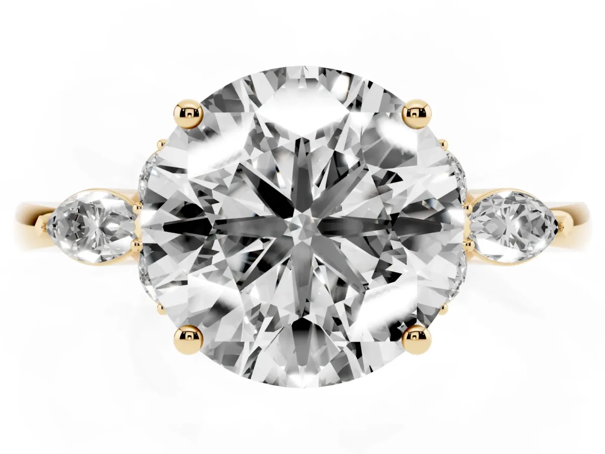 Round Cut Brilliant Diamond Solitaire Ring with Pear Side Stones and Four-Prong Setting Yellow gold