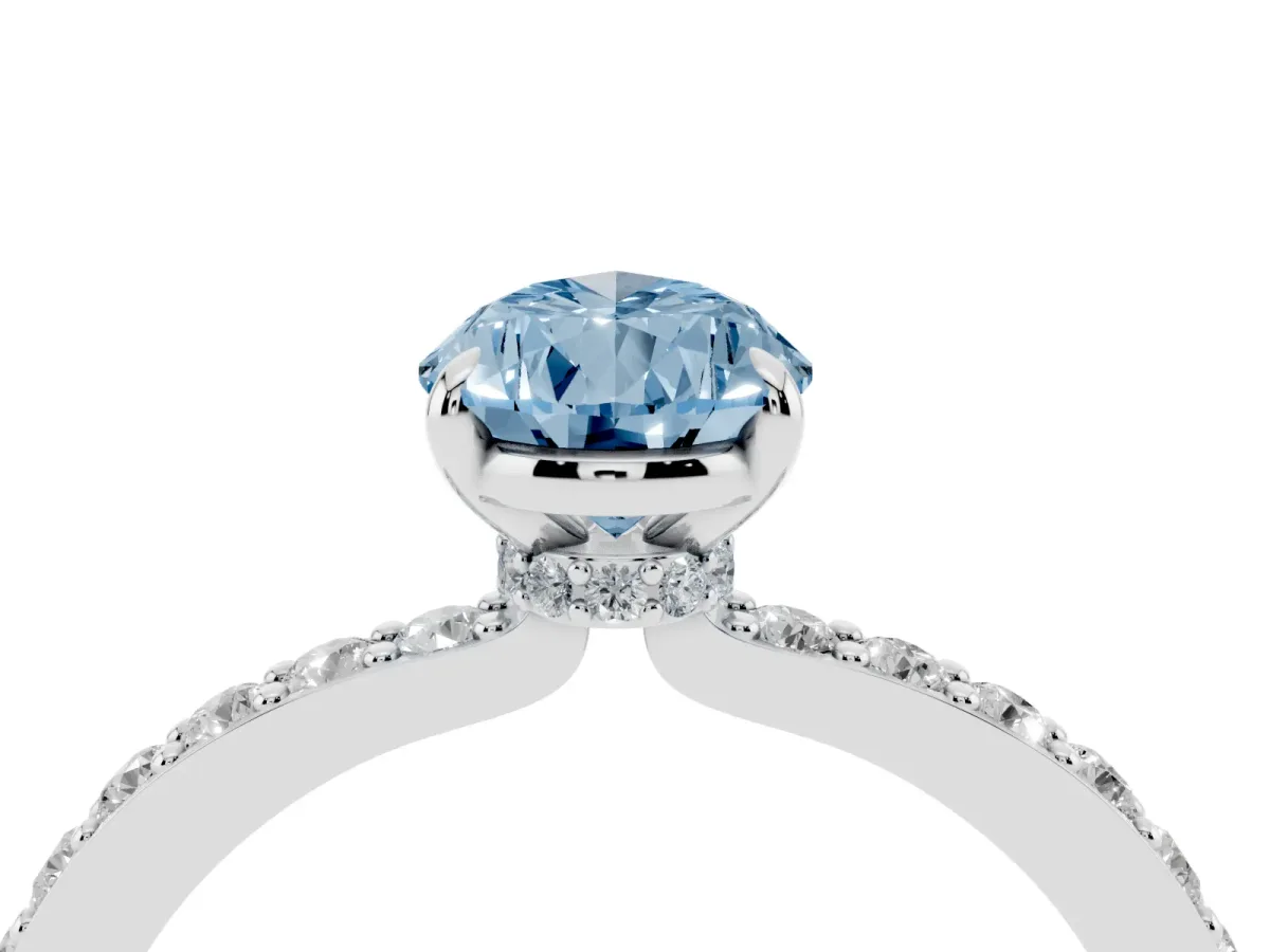 Fancy Blue Pear Cut Diamond Pavé Engagement Ring with Round Accents and Prong Setting Platinum