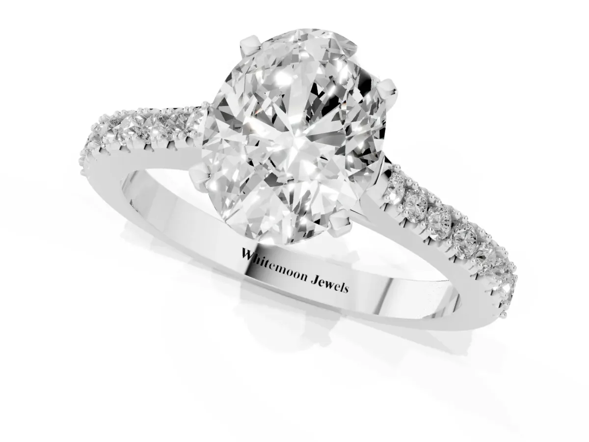 Oval Cut Cut Solitaire Diamond Engagement Ring with Pave Band and Four-Prong Setting Silver