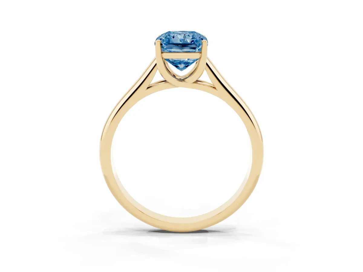 Fancy Blue Radiant Cut Solitaire Engagement Ring with Tapered Band and Four-Prong Setting Yellow gold