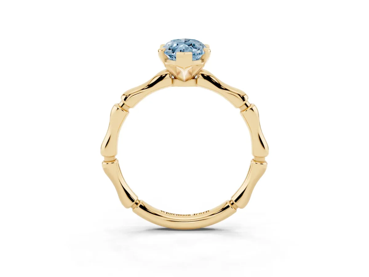 Fancy Blue Marquise Cut Solitaire Diamond Ring with Bamboo Band and Four-Prong Setting Yellow gold