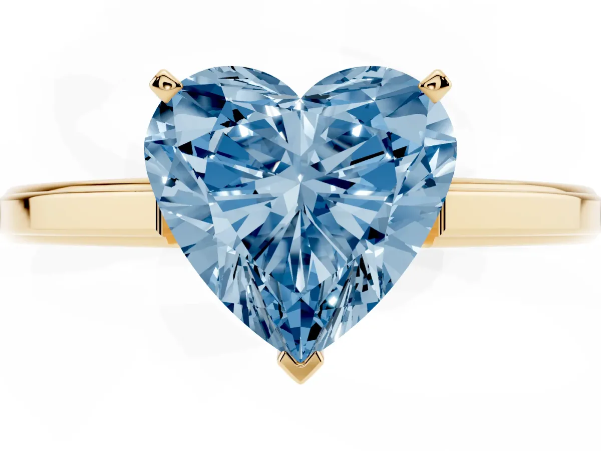 Fancy Blue Heart Cut Solitaire Diamond Ring with Four-Prong Setting and Classic Band Yellow gold