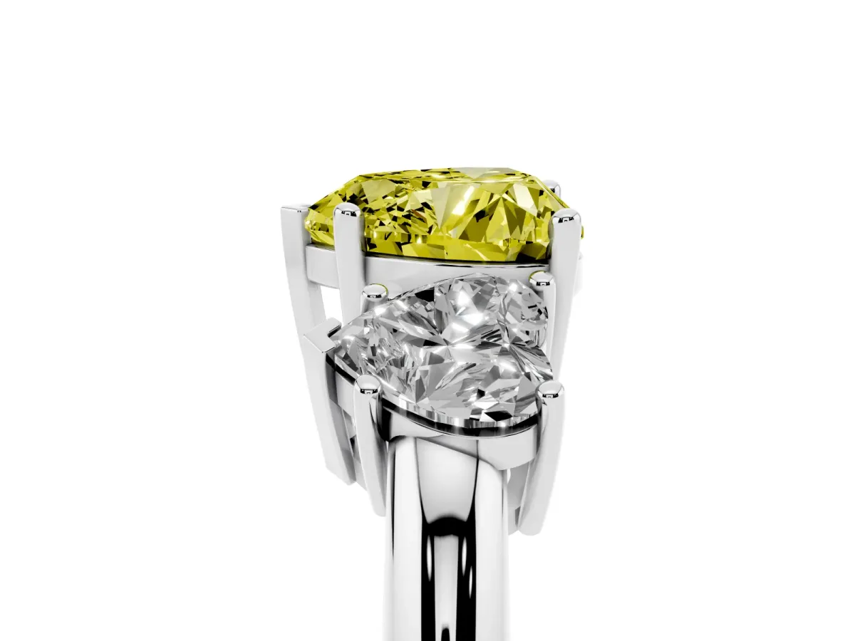 Fancy Yellow Three-Stone Heart Cut Cut Diamond Engagement Ring with Prong Setting on a White Gold Band Silver