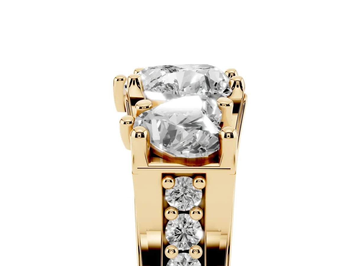 Heart Cut Diamond Three-Stone Ring with Channel Set Band and Four-Prong Setting Yellow gold
