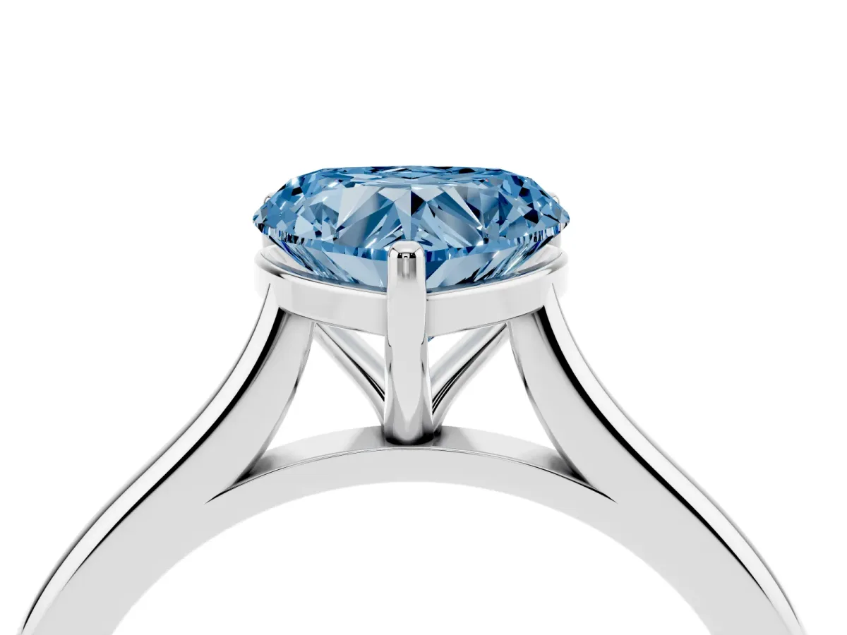 Fancy Blue Heart Cut Cut Solitaire Ring with Cathedral Band and Four-Prong Setting Silver
