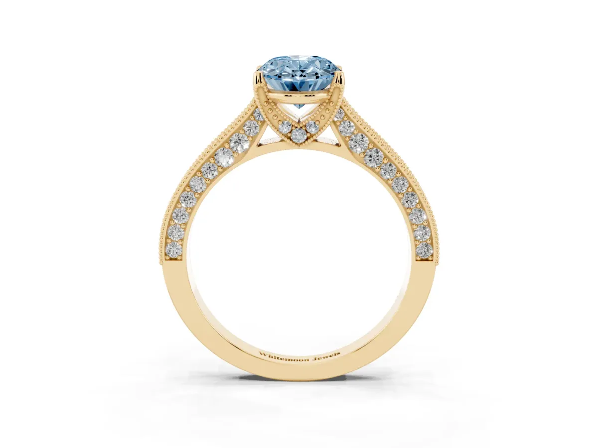 Fancy Blue Oval Cut Cut Diamond Solitaire Ring with Milgrain Pave Band and Four Prong Setting Yellow gold