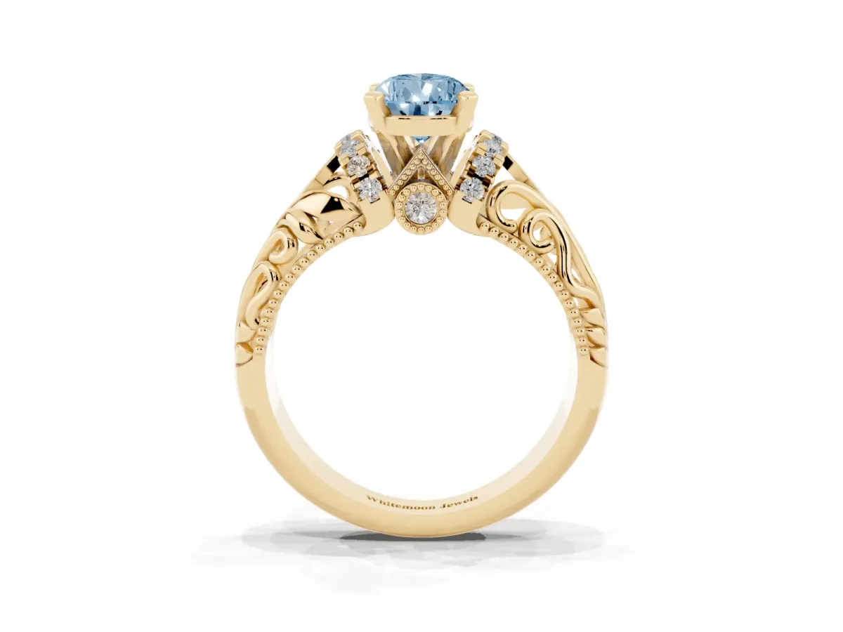 Fancy Blue Pear Cut Solitaire Filigree Engagement Ring with Halo and Prong Setting Yellow gold