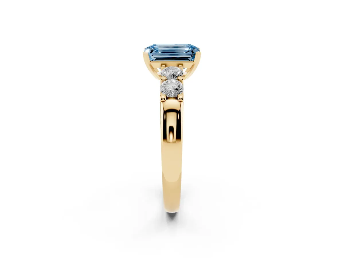 Fancy Blue Emerald Cut Brilliant Cut Diamond Five-Stone Prong Set Engagement Ring with Channel Band Yellow gold