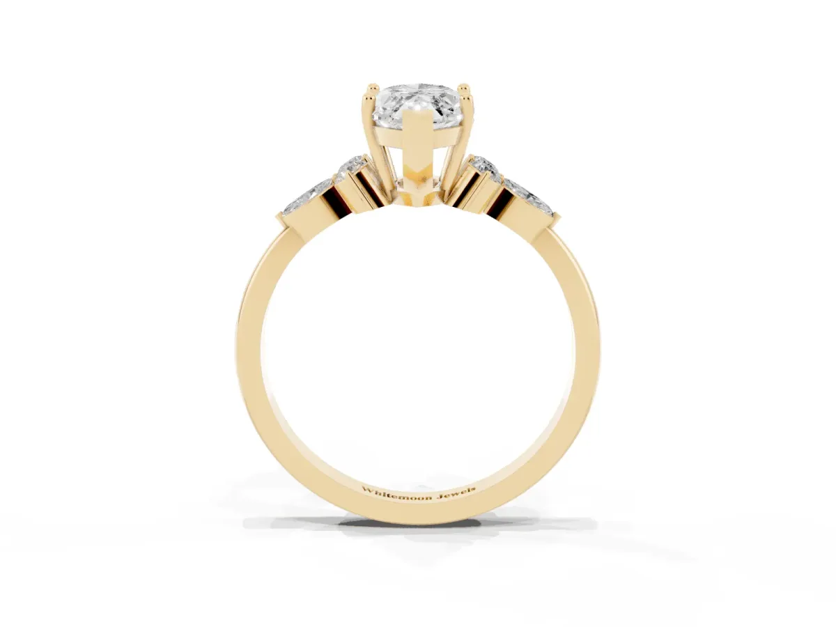 Marquise Cut Brilliant Diamond Solitaire Ring with Pear Side Stones and Four-Prong Setting Yellow gold