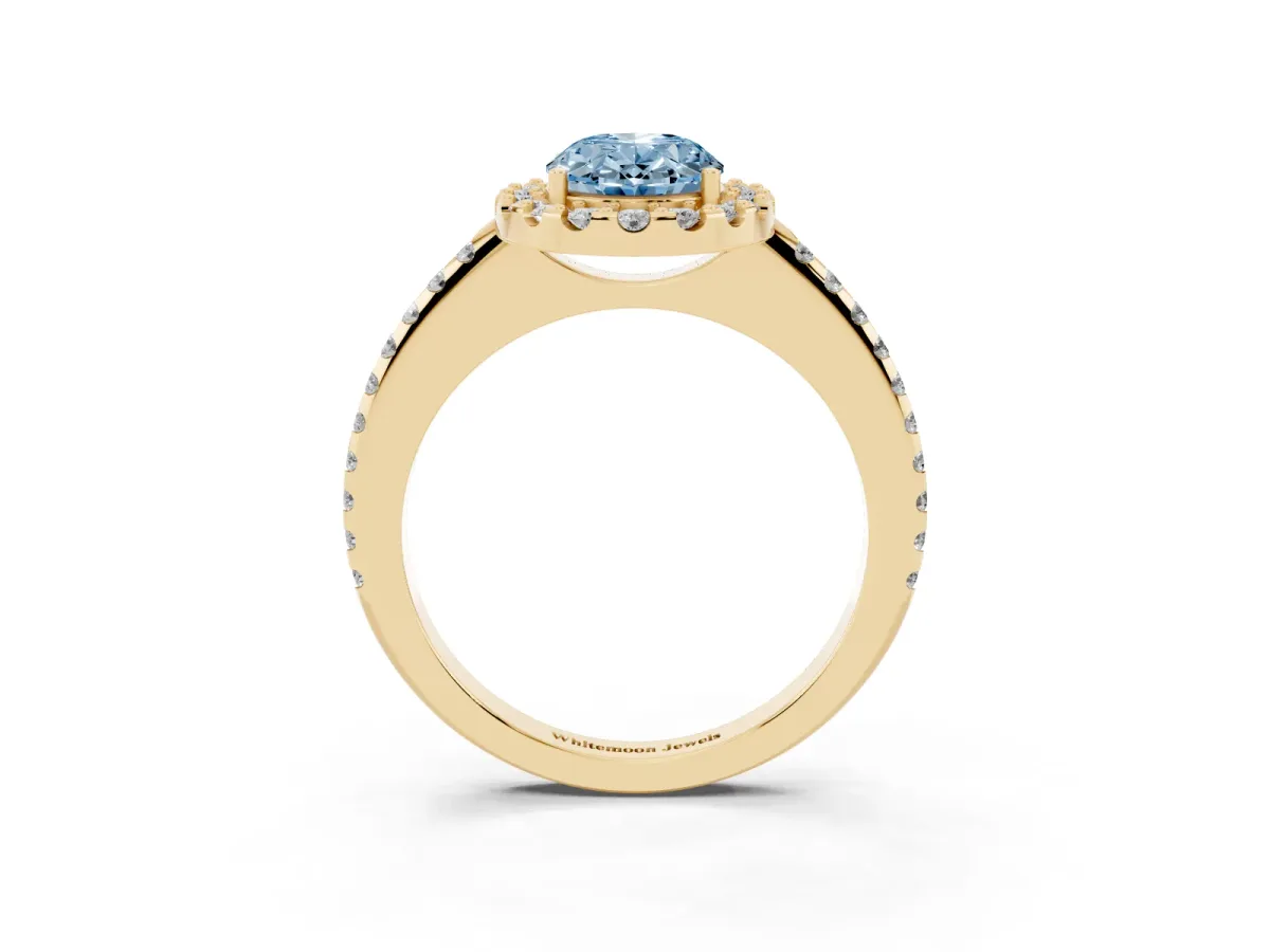 Fancy Blue Oval Cut Diamond Pavé Halo Ring with Four-Prong Setting Yellow gold