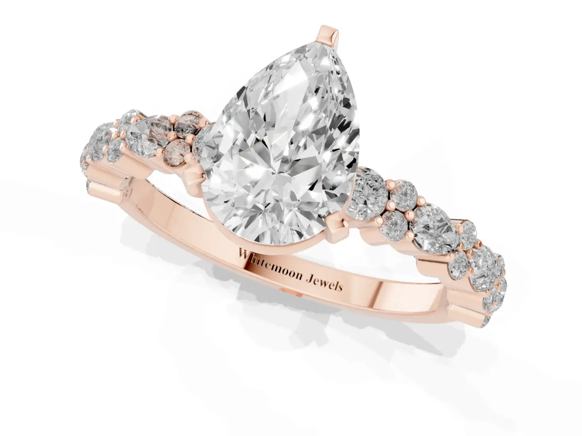 Pear Cut Diamond Side Stone Solitaire Ring with Round and Four-Prong Setting Rose gold