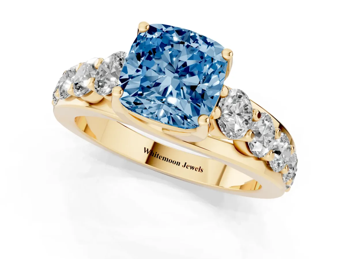Fancy Blue Cushion Cut Diamond Engagement Ring with Pavé Band and Four-Prong Setting Yellow gold