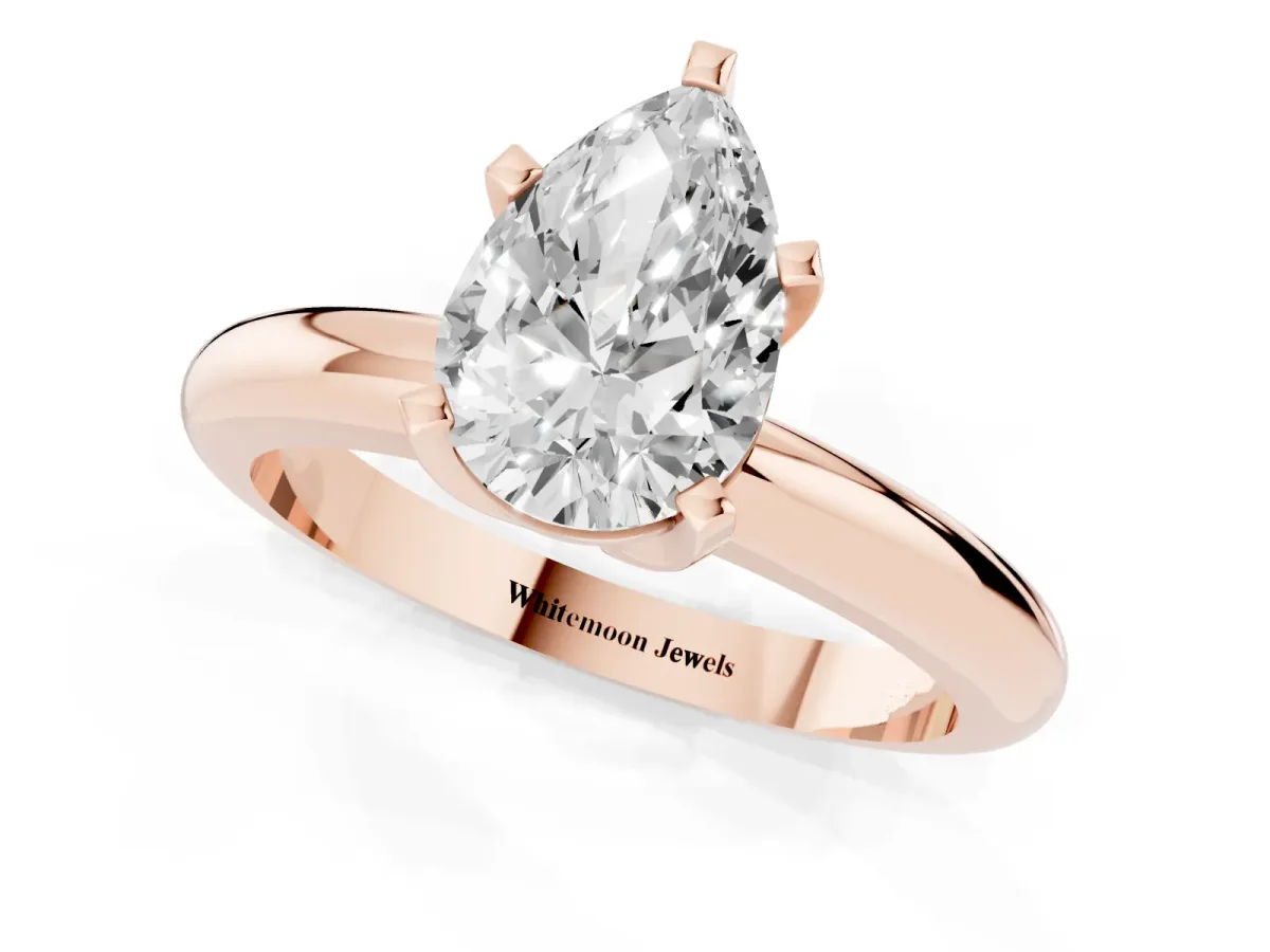 Pear Cut Diamond Solitaire Engagement Ring with Round Band and Four-Prong Setting Rose gold