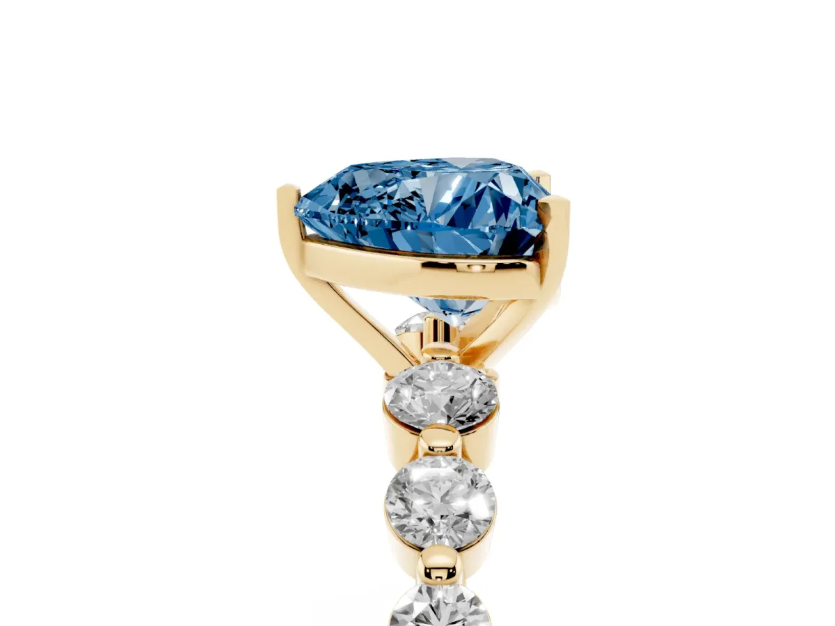 Fancy Blue Heart Cut Solitaire Diamond Ring with Pave Band and Four-Prong Setting Yellow gold