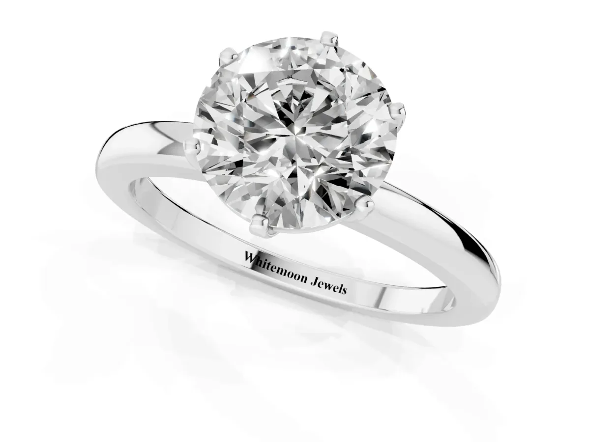 Round Cut Solitaire Diamond Ring with Six-Prong Setting on a Classic Band Silver