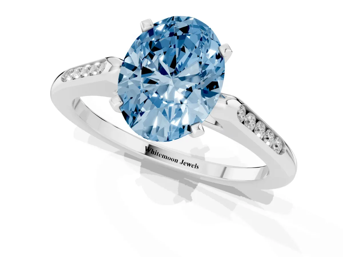 Fancy Blue Oval Cut Diamond Solitaire Ring with Channel Set Round Band and Prong Setting Silver