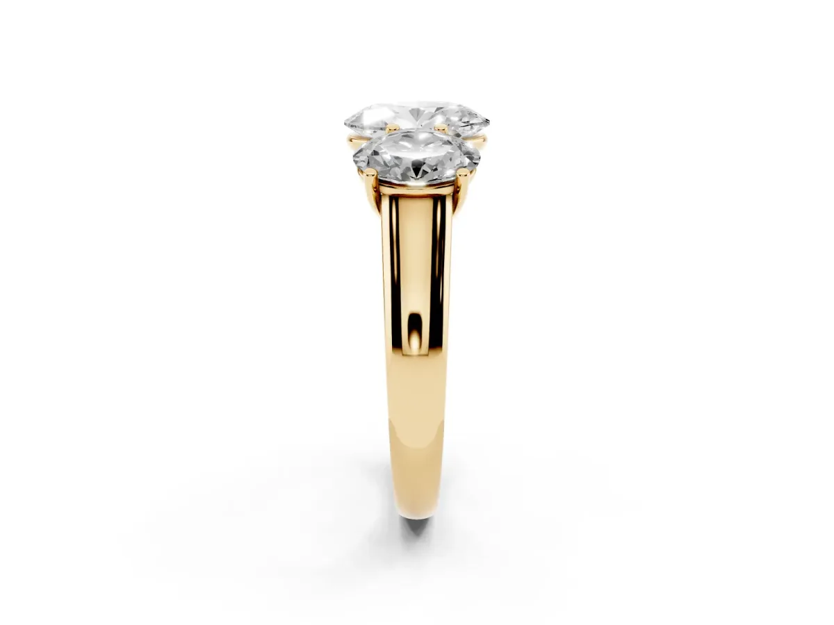 Oval Cut Three-Stone Diamond Ring with Prong Setting on a Classic Band Yellow gold