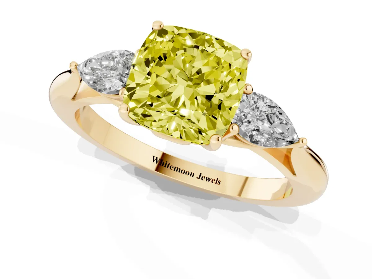 Fancy Yellow Three-Stone Cushion Cut Diamond Ring with Pear Side Stones in Four-Prong Setting Yellow gold