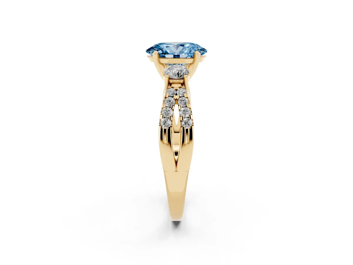 Fancy Blue Oval Cut Diamond Three-Stone Ring with Pavé Split Shank and Four-Prong Setting Yellow gold