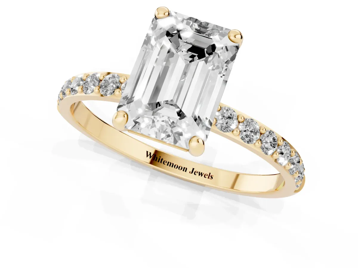 Emerald Cut Diamond Solitaire Ring with Round Pavé Band and Prong Setting Yellow gold