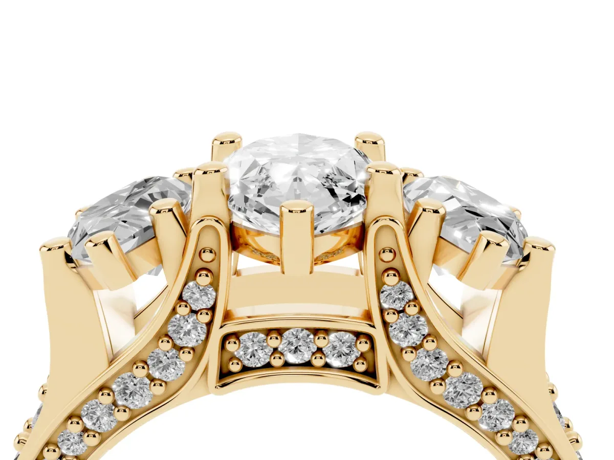 Marquise Cut Diamond Three-Stone Ring with Channel Set Band and Four-Prong Setting Yellow gold