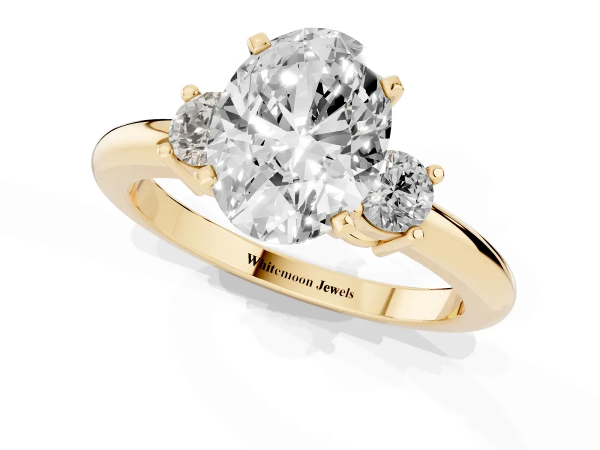 Three-Stone Oval Cut Cut Diamond Solitaire with Prong Setting and Classic Band Yellow gold