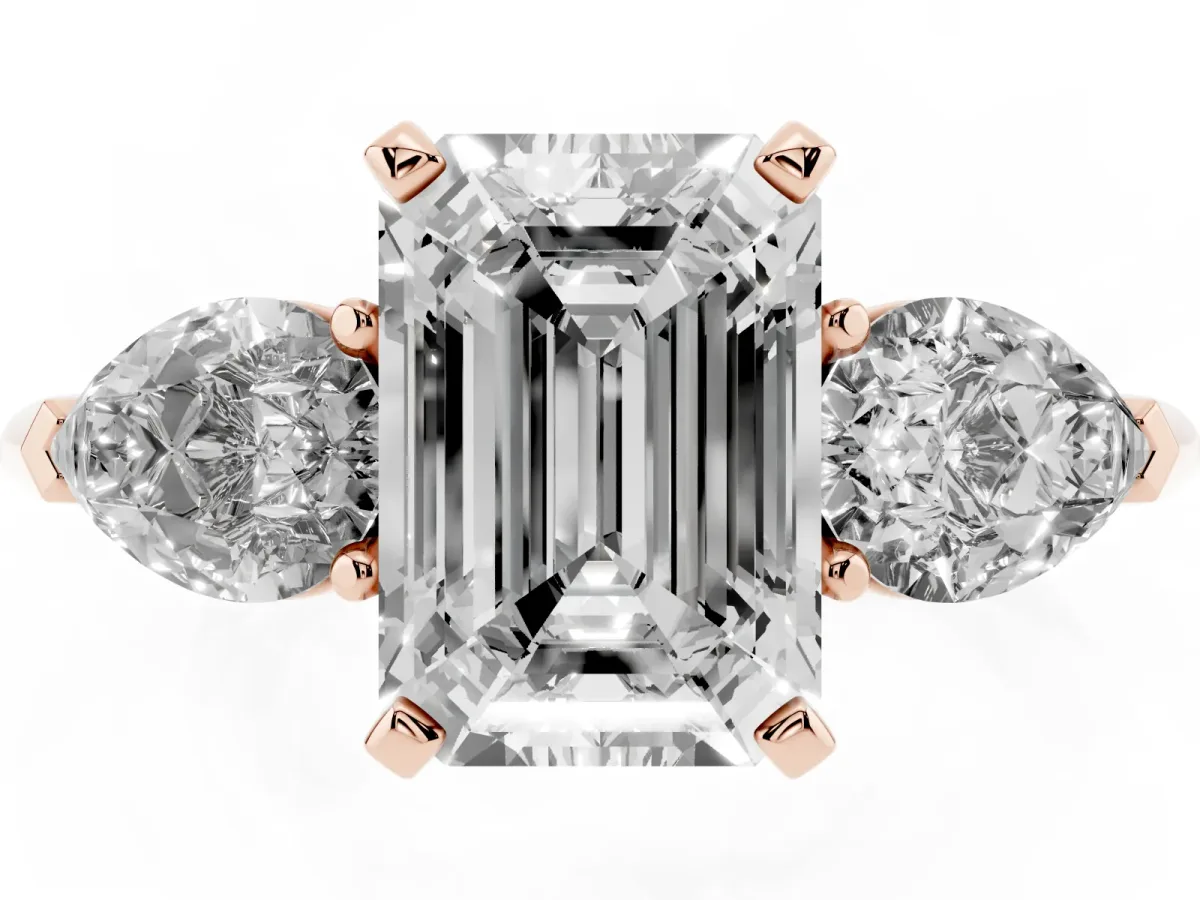 Three-Stone Emerald Cut Diamond Ring with Pear Side Stones and Four-Prong Setting Rose gold